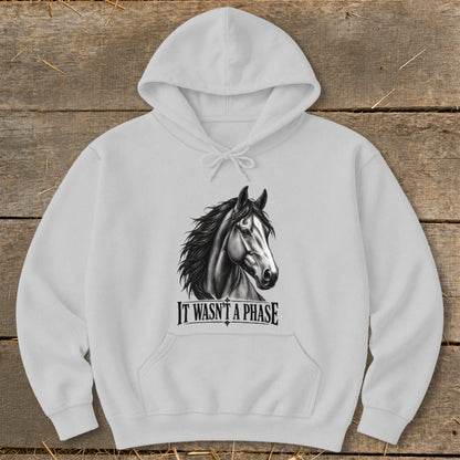 White hoodie with a black and white horse head graphic and text "IT WASN'T A PHASE".