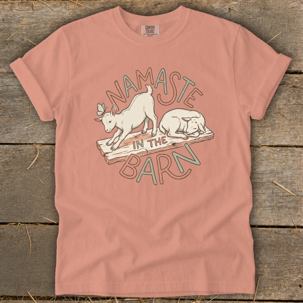 Namaste in the Barn design with two goats on wooden planks.
