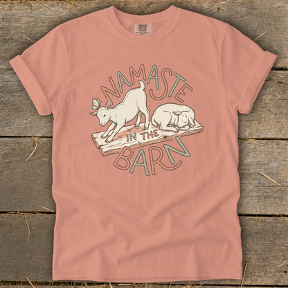 Namaste in the Barn design with two goats on wooden planks.
