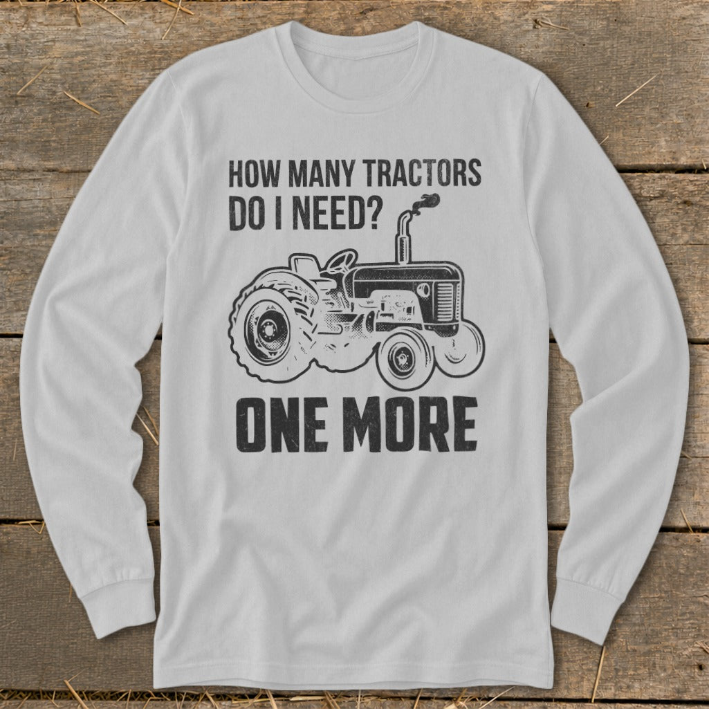Long sleeve shirt with "How Many Tractors Do I Need? One More" and tractor graphic.