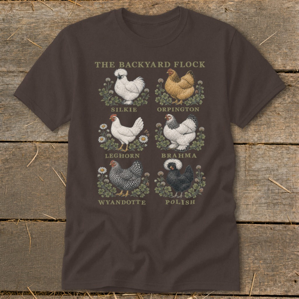 Brown t-shirt with illustrations of six chicken breeds: Silkie, Orpington, Leghorn, Brahma, Wyandotte, and Polish.