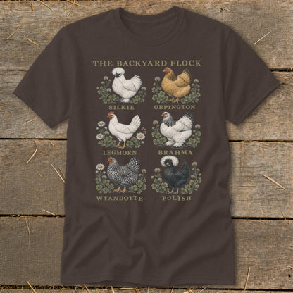 Brown t-shirt with illustrations of six chicken breeds: Silkie, Orpington, Leghorn, Brahma, Wyandotte, and Polish.