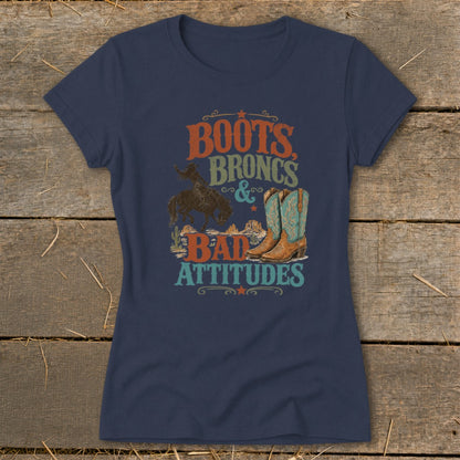 Dark blue t-shirt with "Boots, Broncs & Bad Attitudes" text and western graphics.