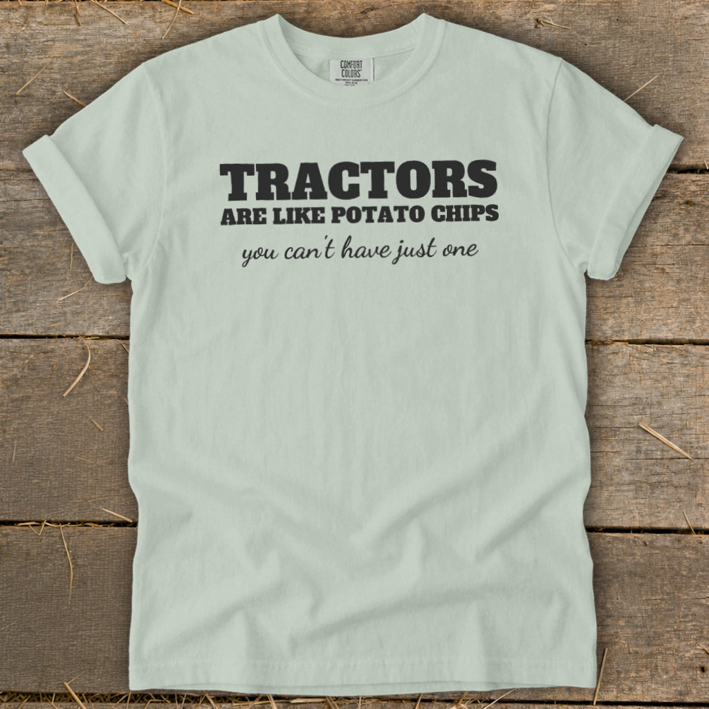 Light mint green t-shirt with black text that says "TRACTORS ARE LIKE POTATO CHIPS you can't have just one."