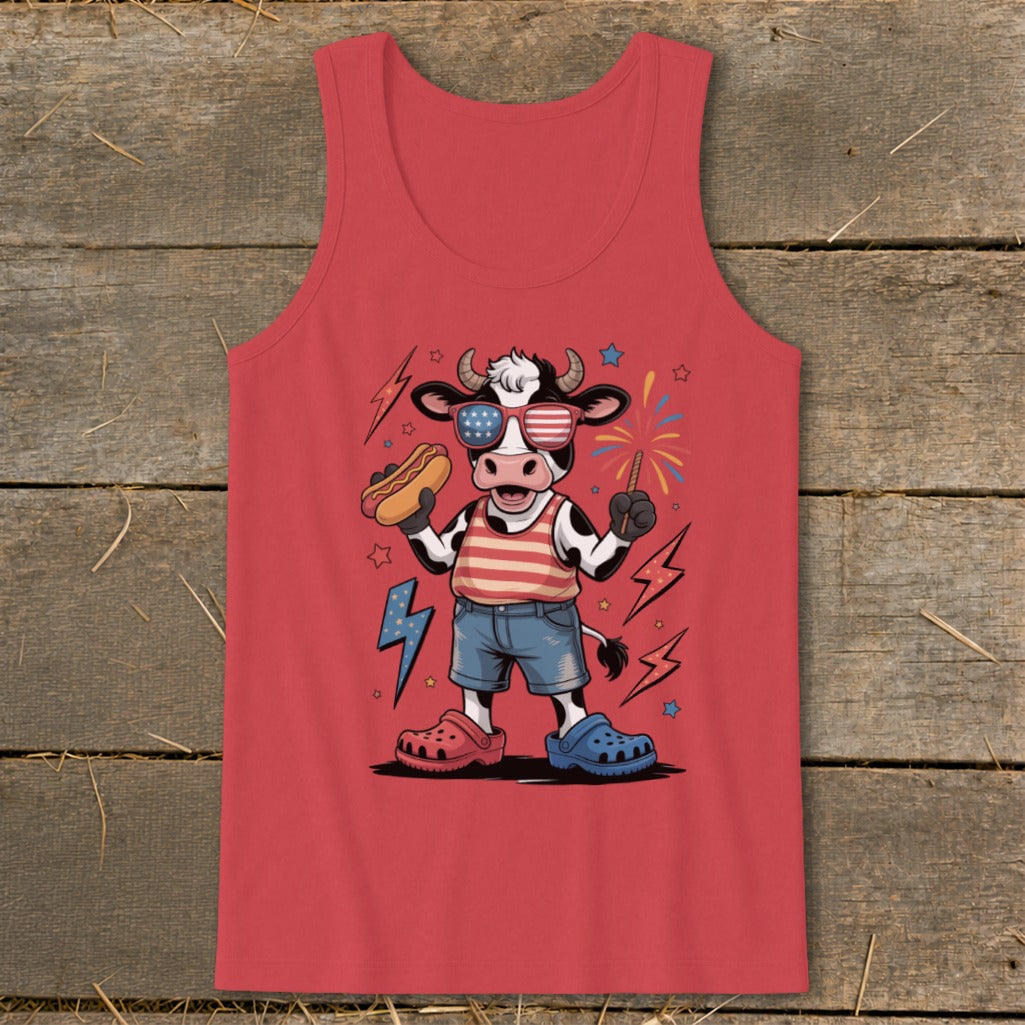 Cow wearing American flag sunglasses and holding hot dog and firecracker.