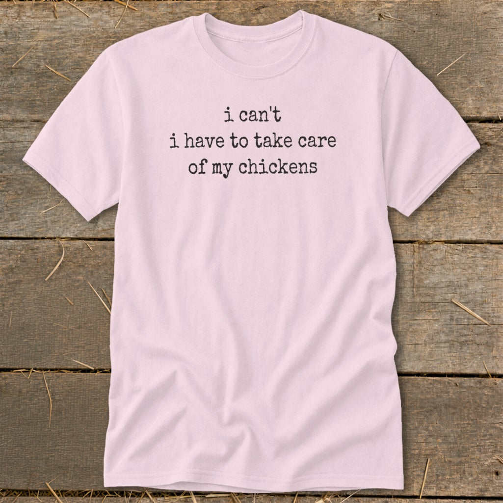 Pink t-shirt with "I can't i have to take care of my chickens" text.