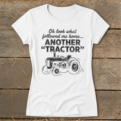 White t-shirt with "Oh look what followed me home... ANOTHER 'TRACTOR'" and tractor graphic.