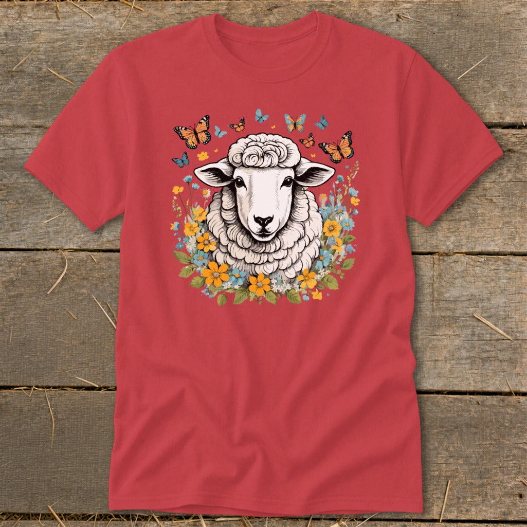 Red t-shirt with illustration of a sheep surrounded by flowers and butterflies.