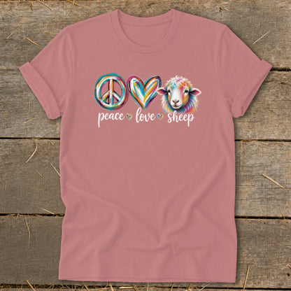 T-shirt with peace sign, heart, and rainbow sheep graphic with text.