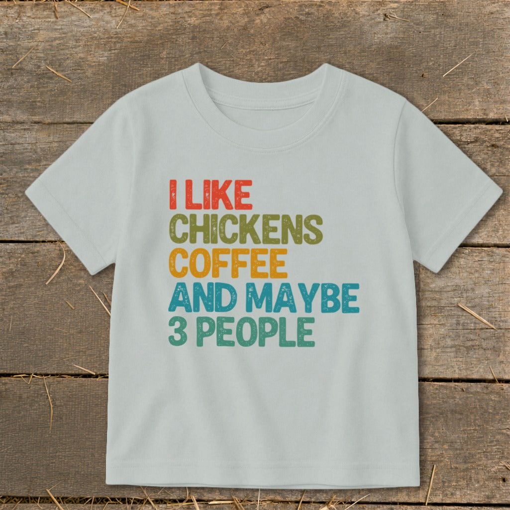 Light grey t-shirt with colorful text: "I like chickens, coffee and maybe 3 people."