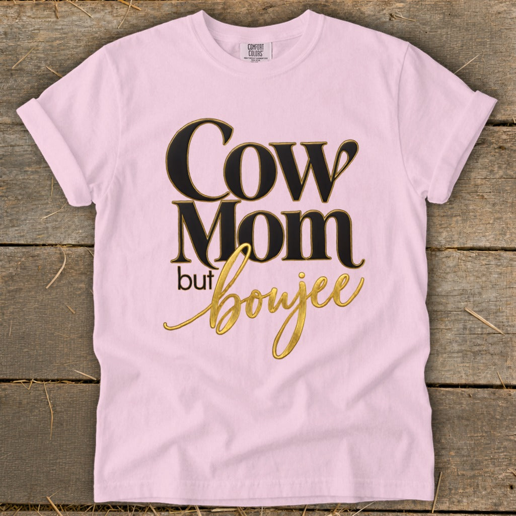 Pink t-shirt with "Cow Mom but boujee" text in black and gold.
