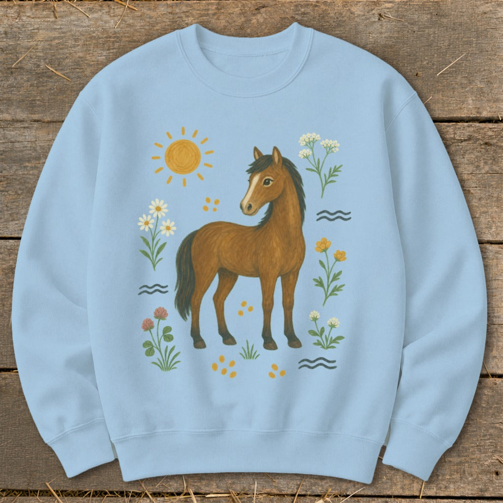 Light blue sweatshirt with a brown horse surrounded by flowers and a sun graphic.