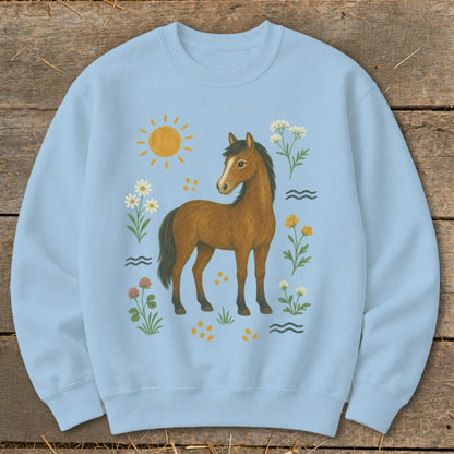 Light blue sweatshirt with a brown horse surrounded by flowers and a sun graphic.