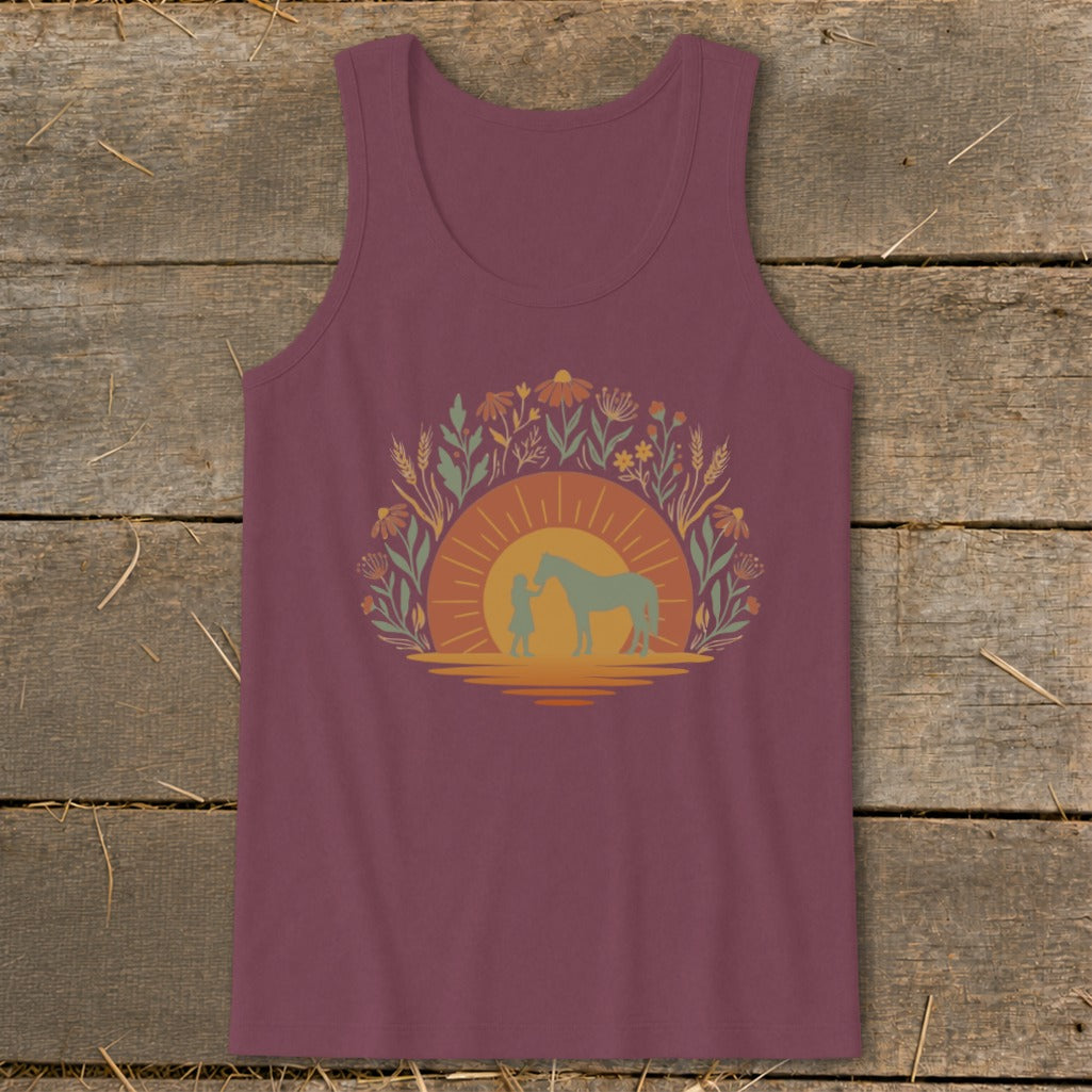 Girl and horse silhouette by a sunset surrounded by flowers on a maroon tank top.