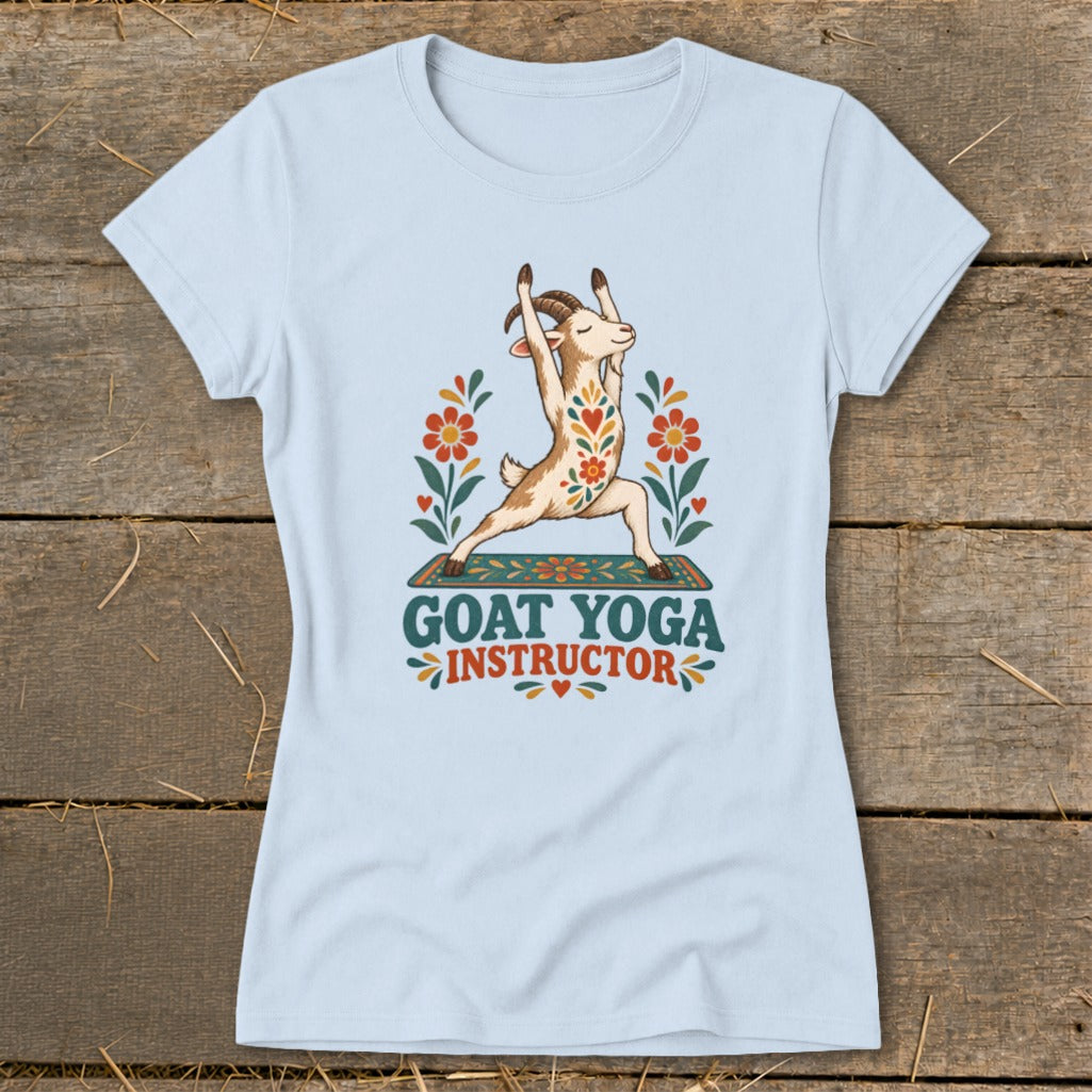 Light blue t-shirt with a goat doing yoga pose, surrounded by flowers, reads "Goat Yoga Instructor".