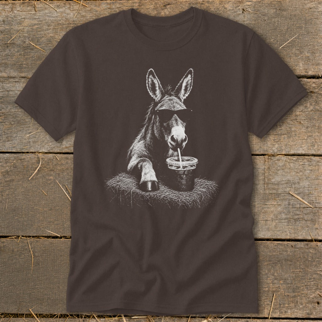 Donkey wearing sunglasses drinks from a cup on a t-shirt graphic.