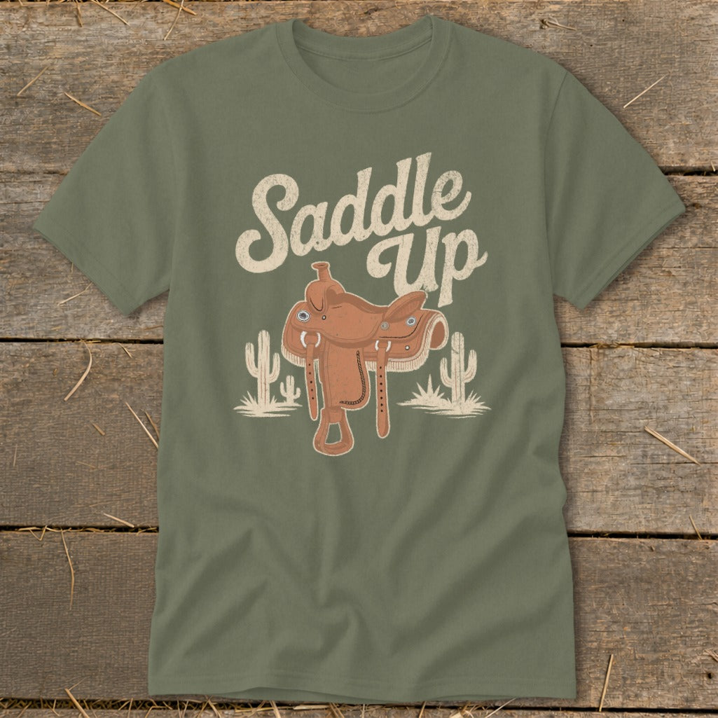 Green t-shirt with "Saddle Up" text, a saddle, and cacti graphic.
