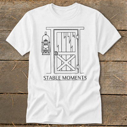 White t-shirt with barn door, lantern graphic, and text "STABLE MOMENTS."