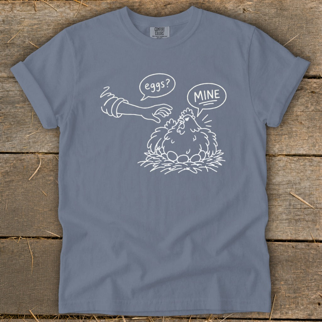 Chicken on nest with eggs, hand asking "eggs?", chicken saying "MINE".