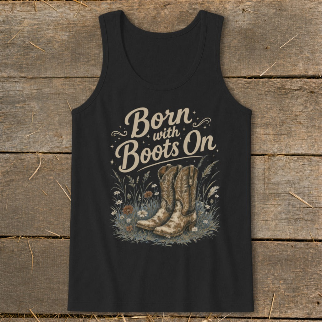 Black tank top with "Born with Boots On" text and cowboy boots in grass.