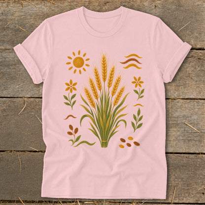 Pink t-shirt with a central bouquet of wheat stalks and surrounding floral and sun graphics.