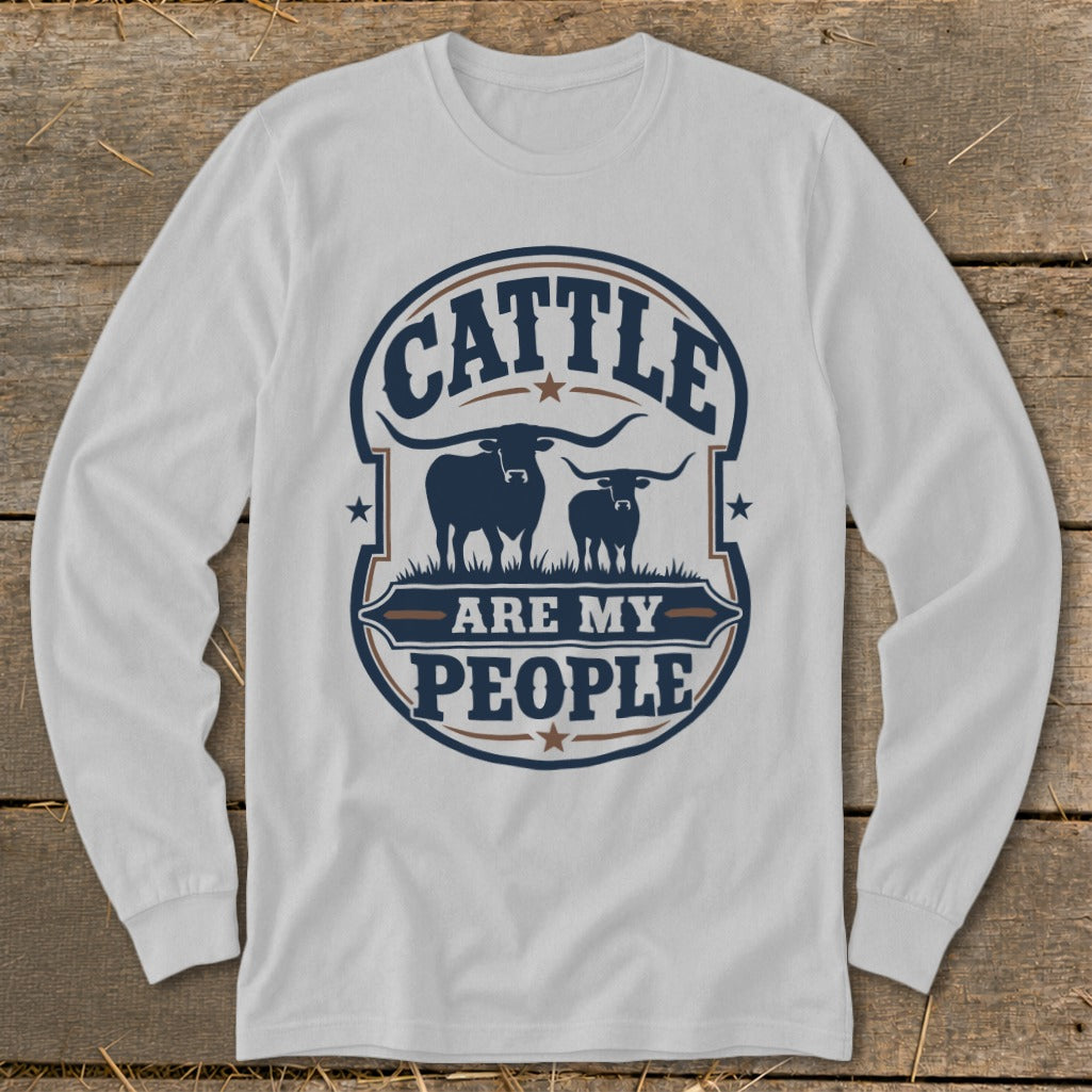 White long sleeve shirt with a graphic reading "Cattle are my People" and two longhorn cattle.