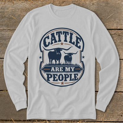 White long sleeve shirt with a graphic reading "Cattle are my People" and two longhorn cattle.