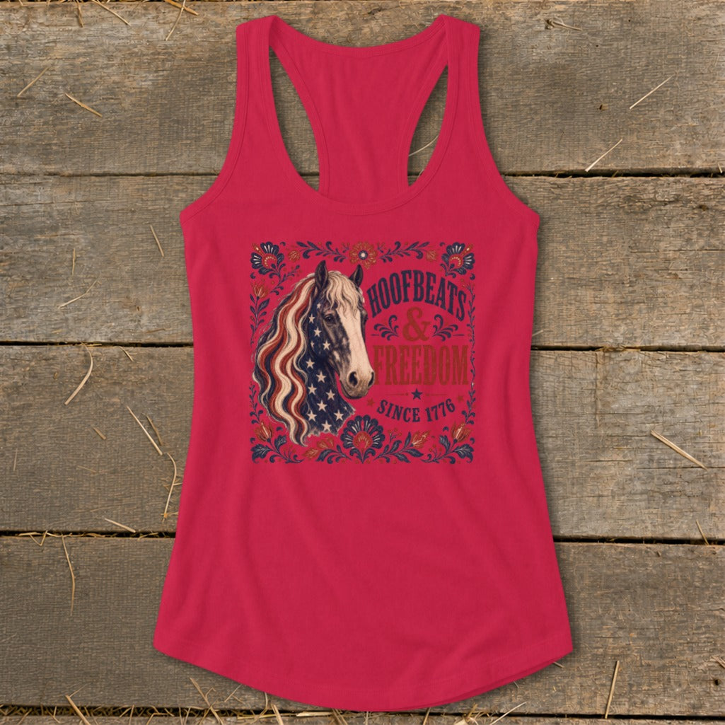 Pink tank top with patriotic horse graphic and text "HOOFBEATS & FREEDOM SINCE 1776".