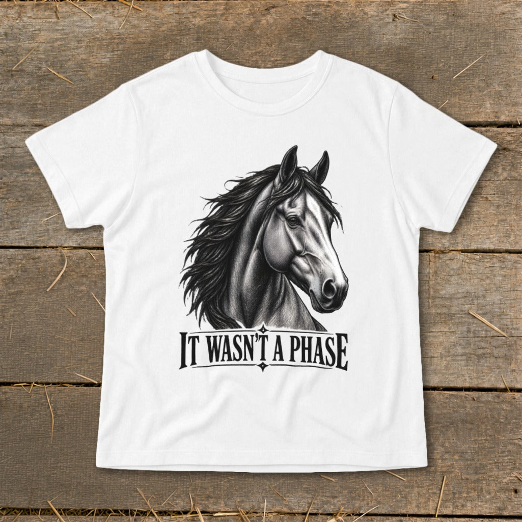 White t-shirt with a detailed charcoal drawing of a horse's head and the text "IT WASN'T A PHASE".