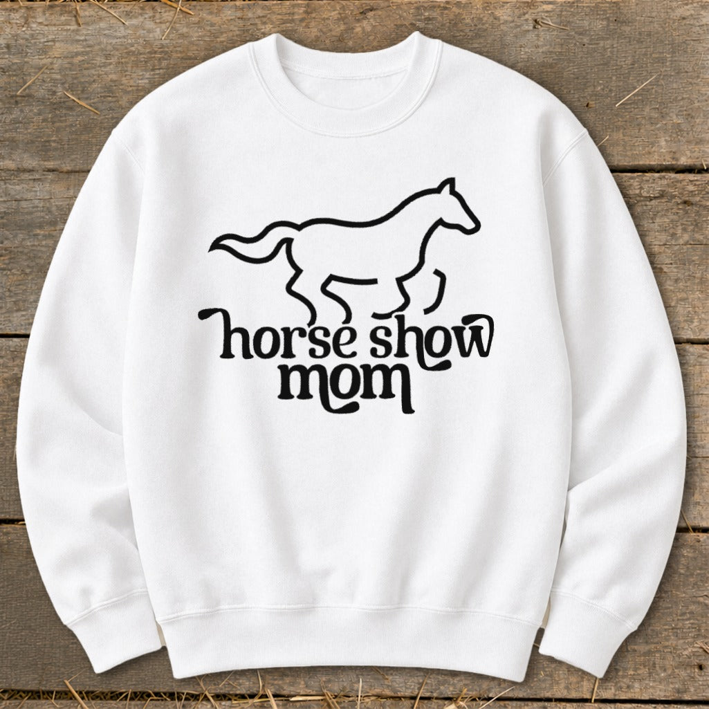 White sweatshirt with a black line drawing of a galloping horse above "horse show mom" text.