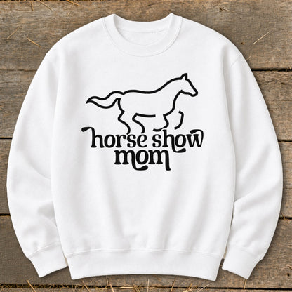White sweatshirt with a black line drawing of a galloping horse above "horse show mom" text.