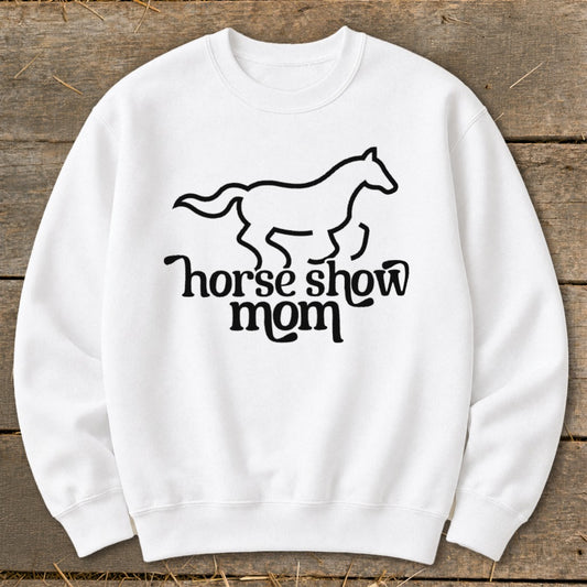 White sweatshirt with a black line drawing of a galloping horse above "horse show mom" text.