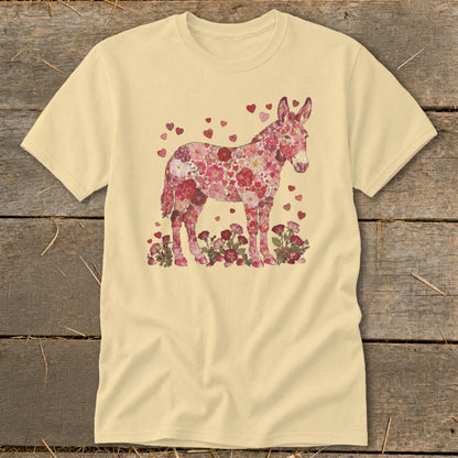 Donkey silhouette filled with pink flowers and hearts, standing among flowers.