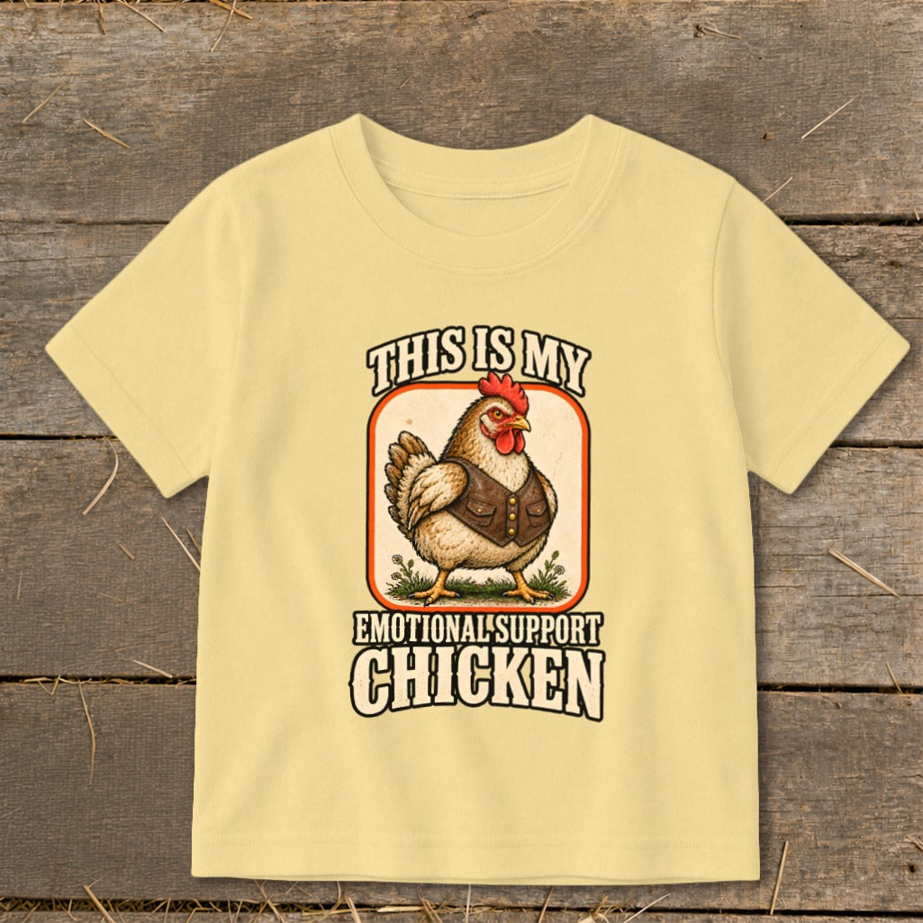 Yellow t-shirt with a chicken graphic that says "This is my Emotional Support Chicken".