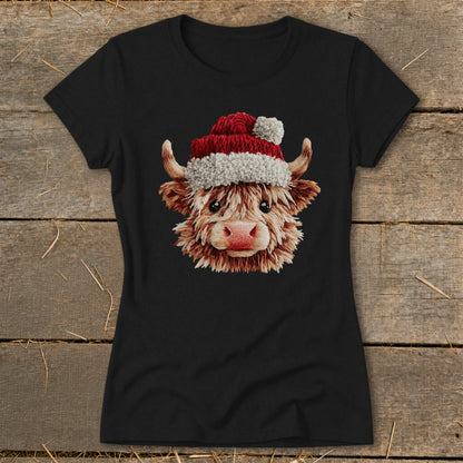 Black t-shirt with a fluffy Highland cow wearing a Santa hat graphic.