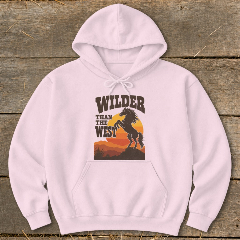 Pink hoodie with "WILDER THAN THE WEST" text and a rearing horse graphic.