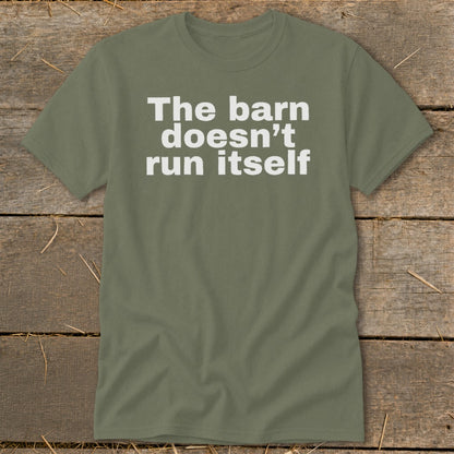 Olive green t-shirt with white text that reads "The barn doesn't run itself."