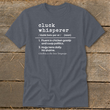 Dark grey t-shirt with "Cluck Whisperer" definition and chicken humor.