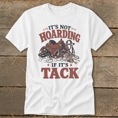 White t-shirt with "It's not hoarding if it's tack" and horse tack graphics.
