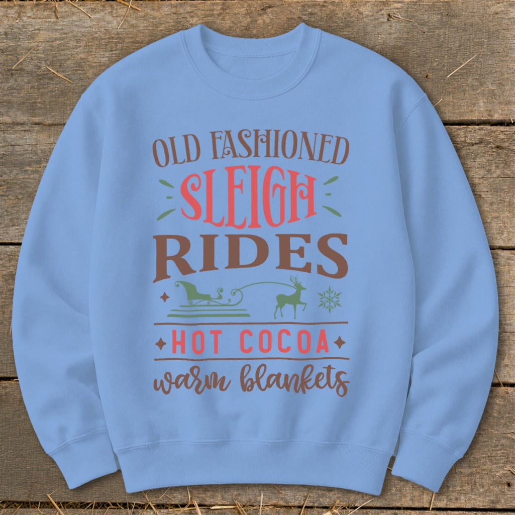 Light blue sweatshirt with "Old Fashioned Sleigh Rides Hot Cocoa Warm Blankets" text.