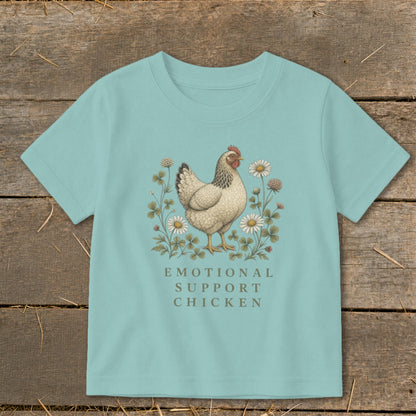 Light blue t-shirt with a chicken illustration and text reading "Emotional Support Chicken".