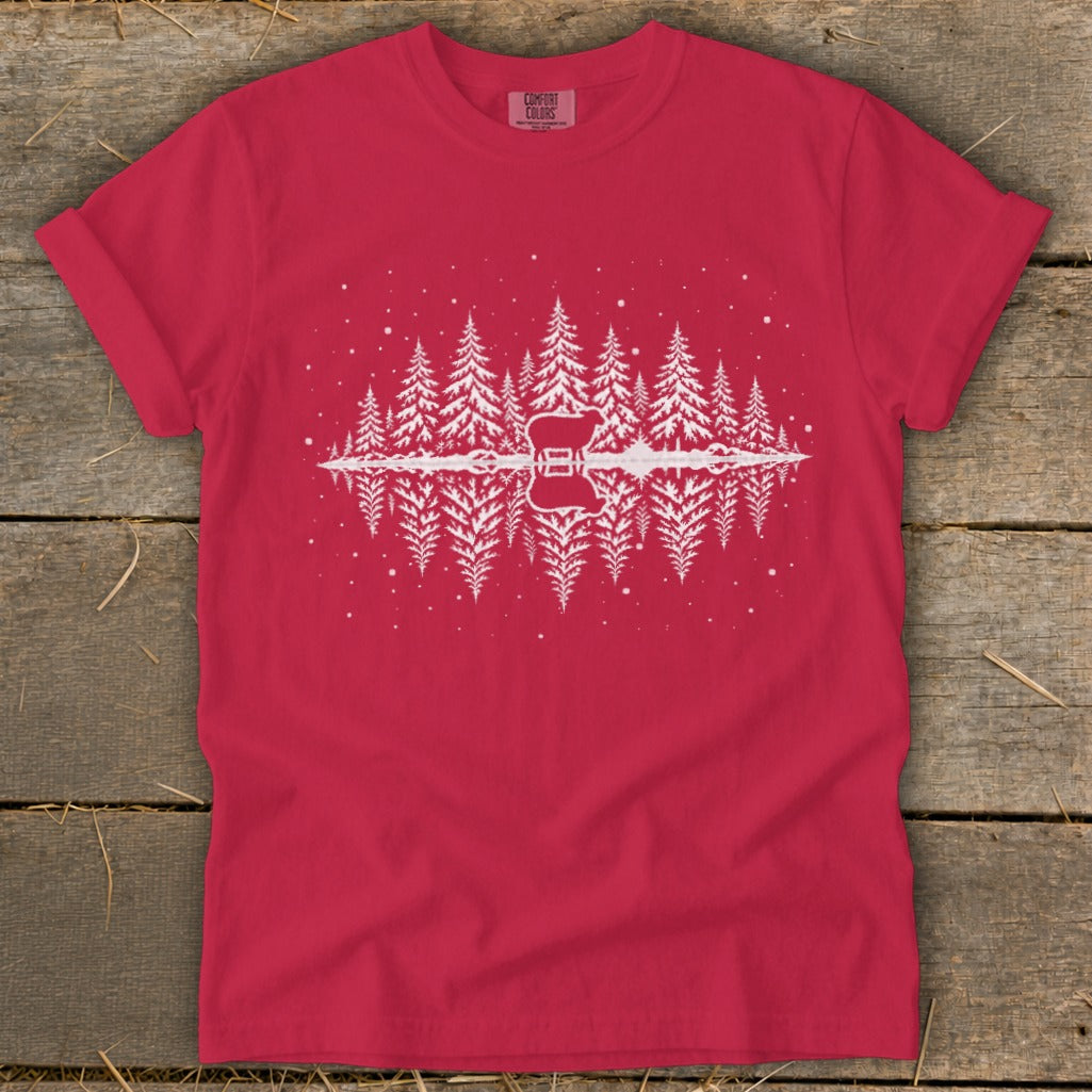Red t-shirt with white graphic of pine trees reflecting in water with a guitar.