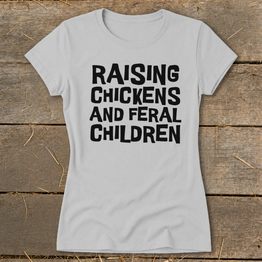 Gray t-shirt with black text reading "RAISING CHICKENS AND FERAL CHILDREN".
