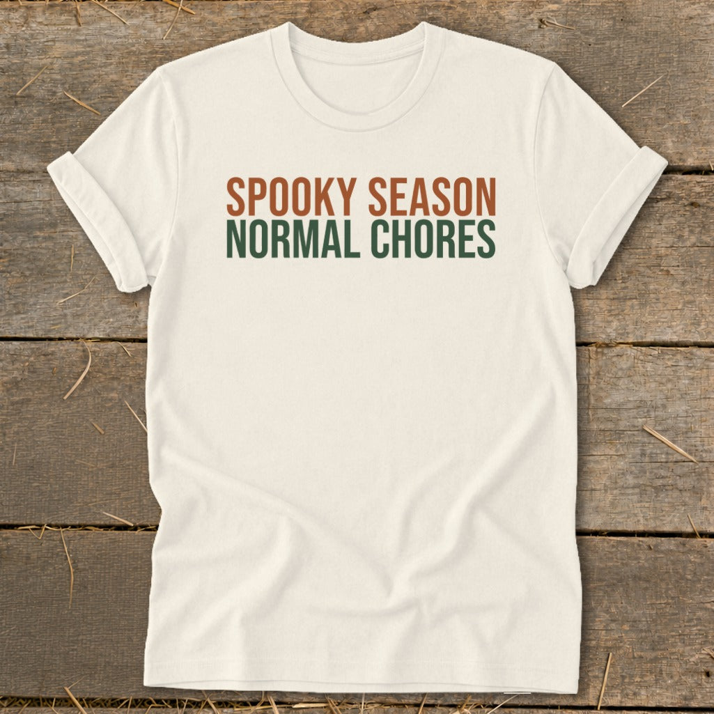 Cream t-shirt with "SPOOKY SEASON NORMAL CHORES" printed on the chest.