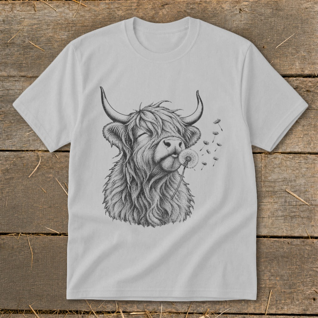 Grey t-shirt with a black ink drawing of a Highland cow blowing a dandelion.