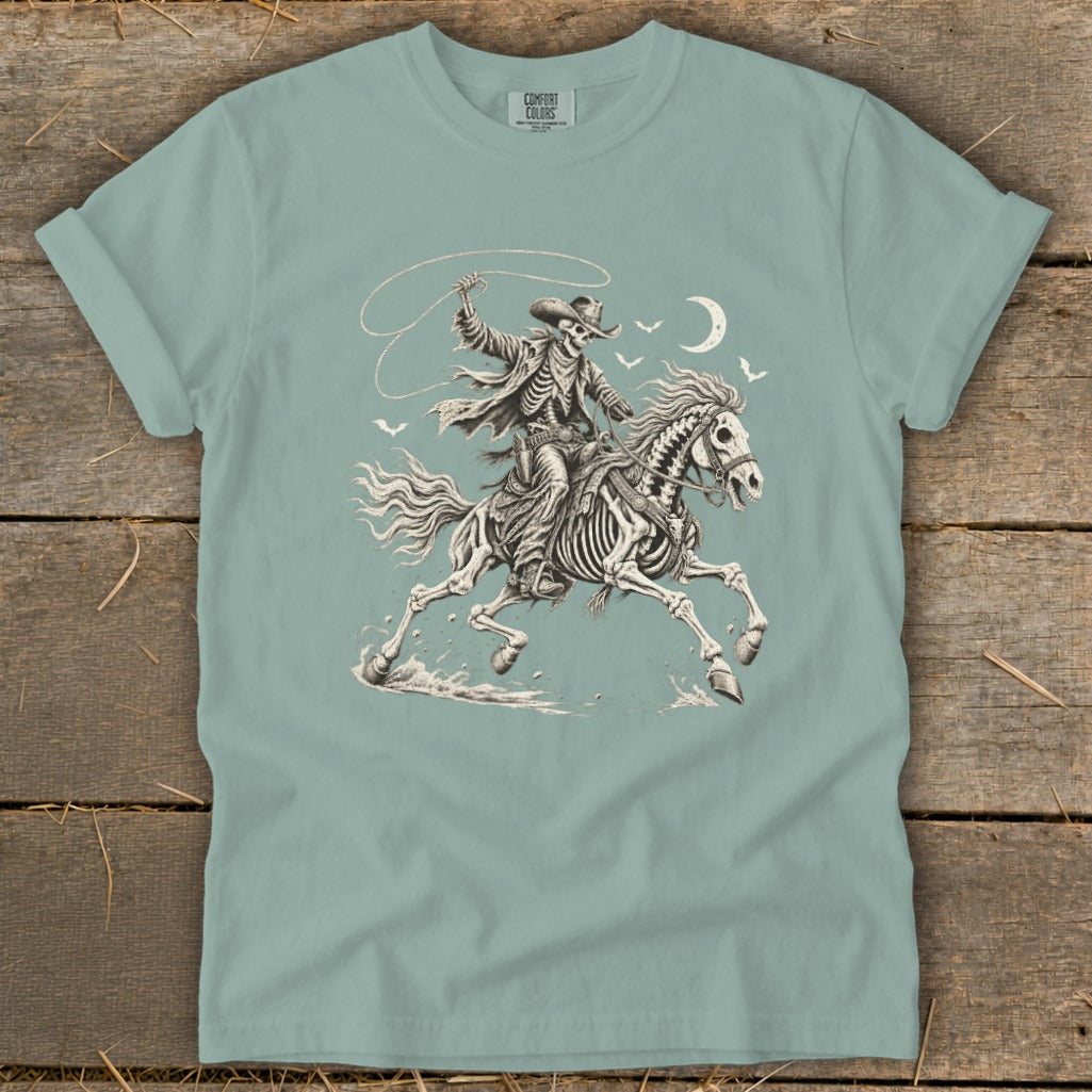 Skeleton cowboy on horseback with lasso, moon, and birds.