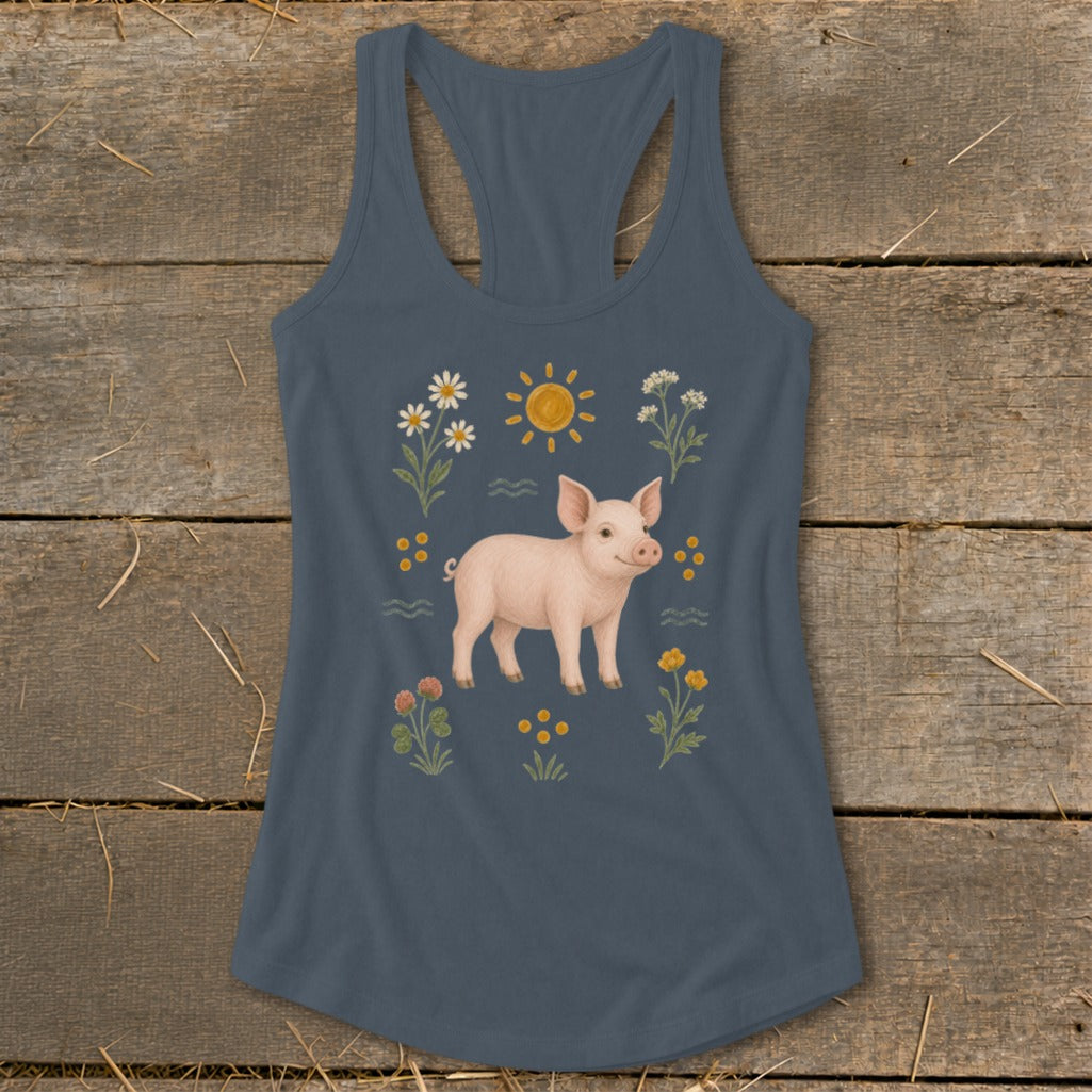 Blue tank top with a pig, sun, and flowers graphic.