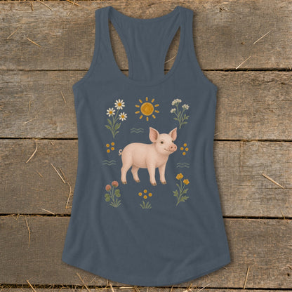 Blue tank top with a pig, sun, and flowers graphic.