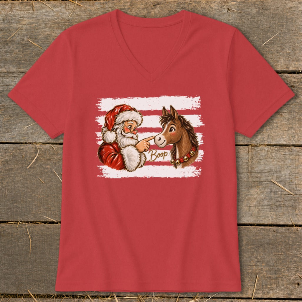 Santa Claus gently booping a horse's nose with "Boop" written in text.