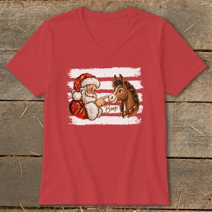 Santa Claus gently booping a horse's nose with "Boop" written in text.